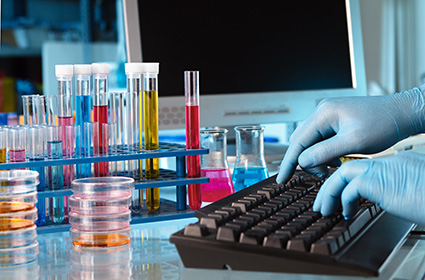 scientist working in the chemistry lab computer